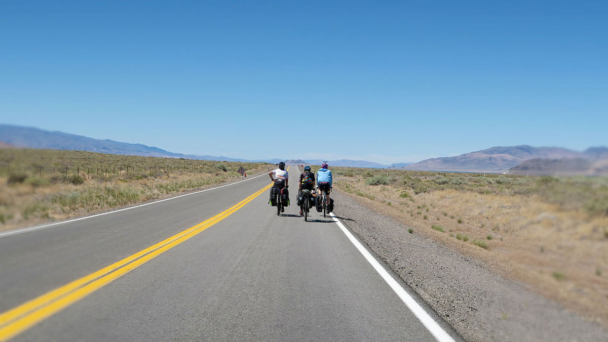 Touring - three men cycling long distance